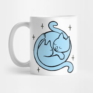 two cats curled up in an embrace Mug